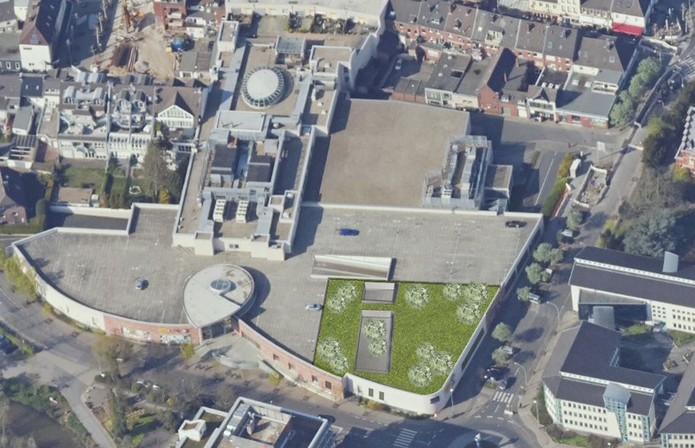 Schmale Architekten stellen Pläne für die Coens-Galerie in Grevenbroich vor. Der einstige Elektromarkt soll für eine Kindertagesstätte mit fünf Gruppen umgebaut werden. Auf den Parkdeck soll ein Garten entstehen.